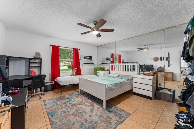 2666 Capp Cir, Kissimmee, FL 34744 - tiled bedroom with an office area, a textured ceiling, and ceiling fan