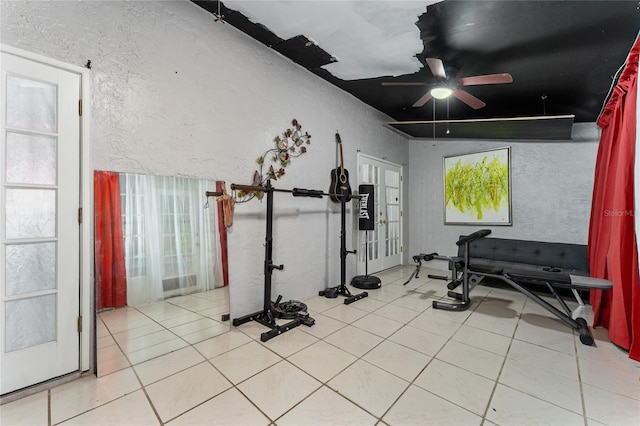 2666 Capp Cir, Kissimmee, FL 34744 - exercise room featuring a textured wall, a ceiling fan, and tile patterned flooring