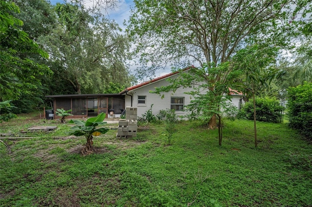 2666 Capp Cir, Kissimmee, FL 34744 - view of yard with a sunroom
