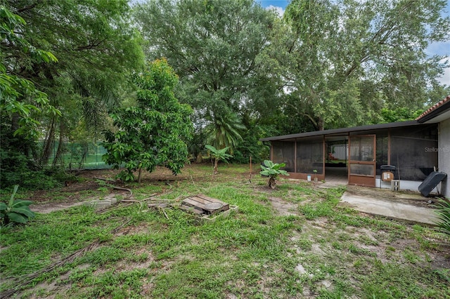 2666 Capp Cir, Kissimmee, FL 34744 - view of yard with a sunroom