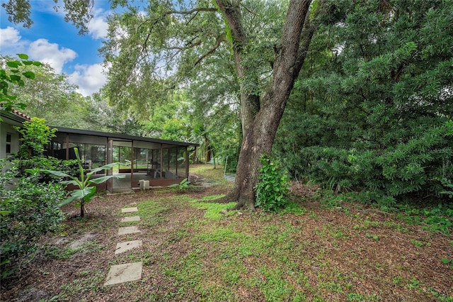 2666 Capp Cir, Kissimmee, FL 34744 - view of yard with a sunroom