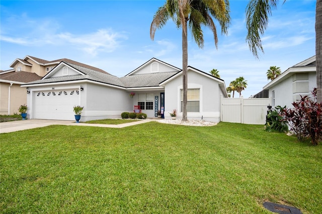 1145 Jaybee Ave, Davenport, FL 33897 - view of front facade featuring a garage, driveway, and stucco siding