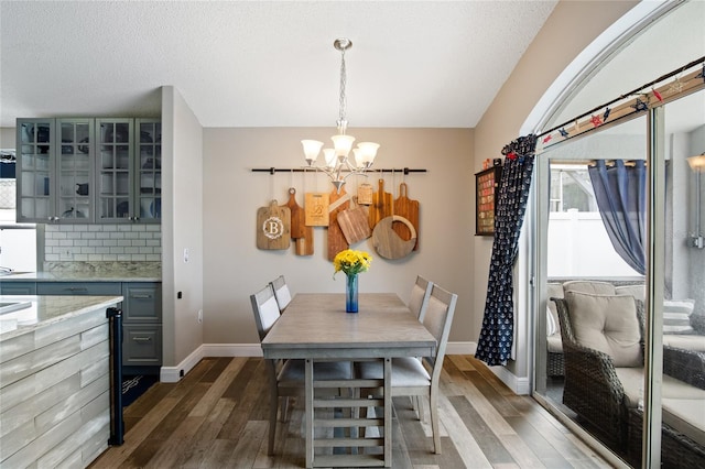 1145 Jaybee Ave, Davenport, FL 33897 - dining area featuring a chandelier and wood finished floors