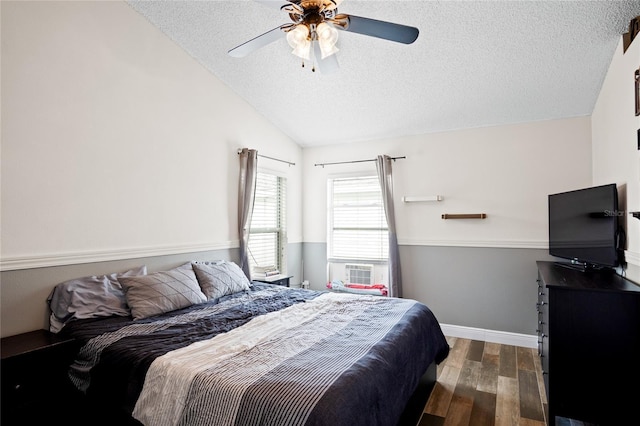 1145 Jaybee Ave, Davenport, FL 33897 - bedroom with a textured ceiling, lofted ceiling, dark wood-style floors, a ceiling fan, and cooling unit