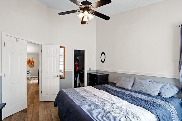 1145 Jaybee Ave, Davenport, FL 33897 - bedroom featuring wood finished floors, a high ceiling, and ceiling fan