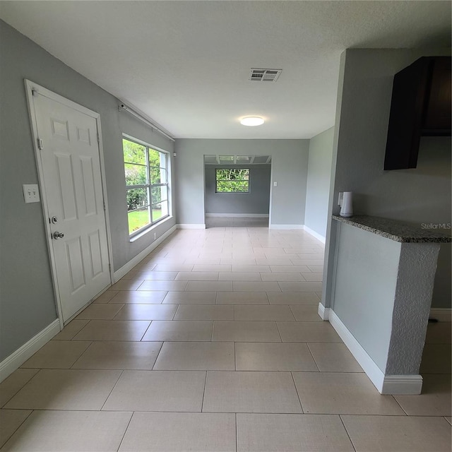 4118 Kirkland Blvd, Orlando, FL 32811 - hallway featuring baseboards and light tile patterned flooring
