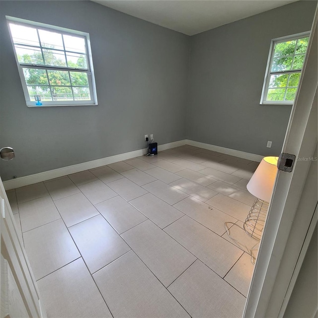 4118 Kirkland Blvd, Orlando, FL 32811 - tiled empty room with baseboards