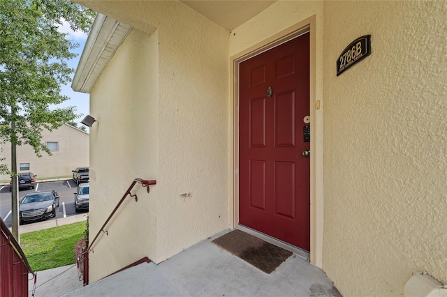 2786 Club Cortile Cir Unit B, Kissimmee, FL 34746 - property entrance featuring stucco siding