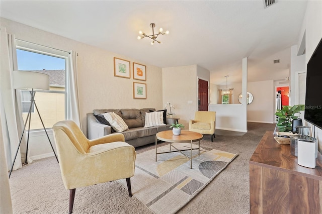 2786 Club Cortile Cir Unit B, Kissimmee, FL 34746 - carpeted living area featuring a chandelier and baseboards