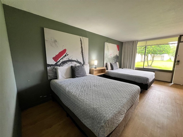 5245 W Irlo Bronson Memorial Hwy Unit 156, Kissimmee, FL 34746 - bedroom with wood finished floors
