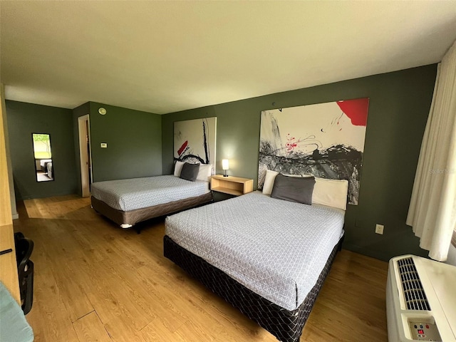 5245 W Irlo Bronson Memorial Hwy Unit 156, Kissimmee, FL 34746 - bedroom featuring wood finished floors and heating unit