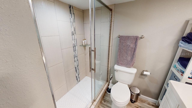133 Oyster Bay Cir Unit 100, Altamonte Springs, FL 32701 - full bath with a stall shower, wood finished floors, a textured wall, and vanity