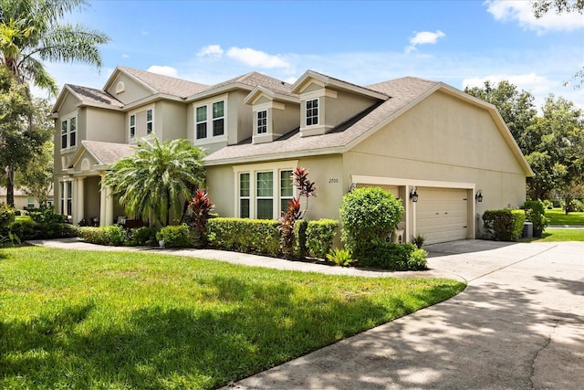 2700 Tree Meadow Loop, Apopka, FL 32712 - traditional-style home featuring a garage, stucco siding, concrete driveway, and a front yard