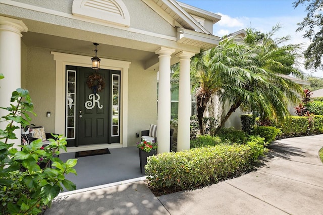 2700 Tree Meadow Loop, Apopka, FL 32712 - entrance to property with stucco siding and covered porch