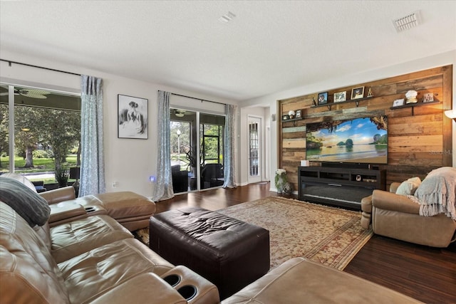 2700 Tree Meadow Loop, Apopka, FL 32712 - living area featuring wood finished floors and a textured ceiling