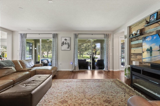 2700 Tree Meadow Loop, Apopka, FL 32712 - living area with wood finished floors and a textured ceiling