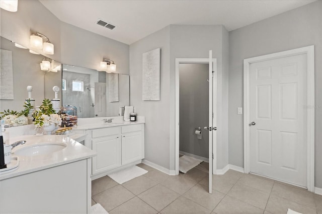 2700 Tree Meadow Loop, Apopka, FL 32712 - bathroom featuring two vanities and tile patterned flooring