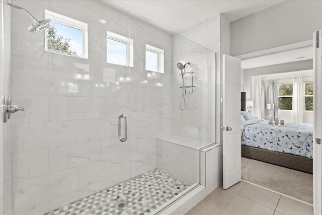 2700 Tree Meadow Loop, Apopka, FL 32712 - bathroom with connected bathroom, a stall shower, healthy amount of natural light, and tile patterned floors