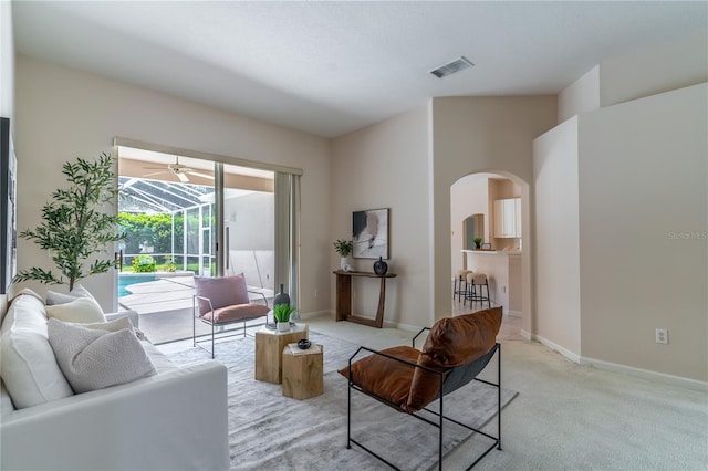 2340 Blackjack Oak St, Ocoee, FL 34761 - living room with arched walkways and light carpet