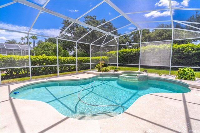 2340 Blackjack Oak St, Ocoee, FL 34761 - view of pool featuring a pool with connected hot tub, a patio, and a lanai