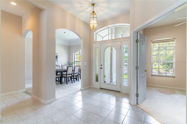 2340 Blackjack Oak St, Ocoee, FL 34761 - entryway with arched walkways, light carpet, and plenty of natural light