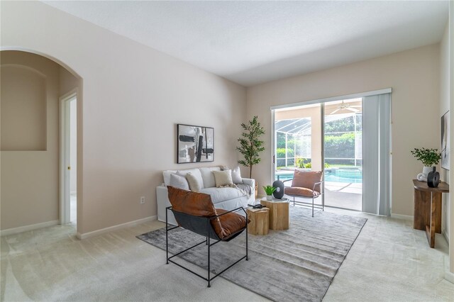2340 Blackjack Oak St, Ocoee, FL 34761 - living area with light colored carpet and arched walkways