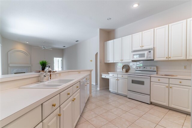 2340 Blackjack Oak St, Ocoee, FL 34761 - kitchen featuring white appliances, tasteful backsplash, light countertops, recessed lighting, and light tile patterned floors
