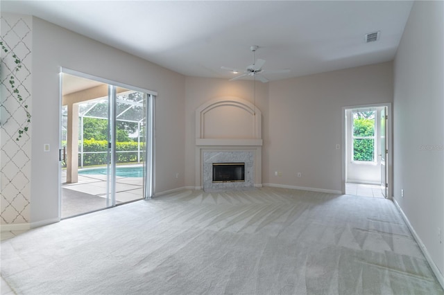 2340 Blackjack Oak St, Ocoee, FL 34761 - unfurnished living room with a ceiling fan, carpet, and a premium fireplace