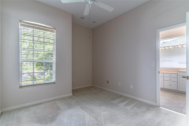 2340 Blackjack Oak St, Ocoee, FL 34761 - unfurnished room featuring light carpet, plenty of natural light, and a ceiling fan