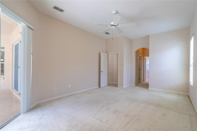 2340 Blackjack Oak St, Ocoee, FL 34761 - unfurnished bedroom with arched walkways, carpet, and a ceiling fan