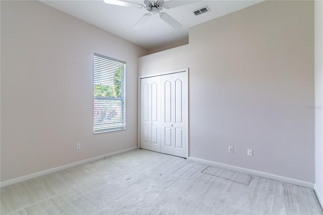 2340 Blackjack Oak St, Ocoee, FL 34761 - unfurnished bedroom featuring light carpet, a closet, and ceiling fan
