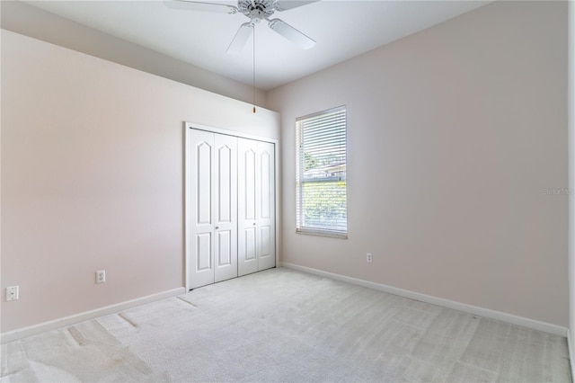 2340 Blackjack Oak St, Ocoee, FL 34761 - unfurnished bedroom with light carpet, a closet, and a ceiling fan
