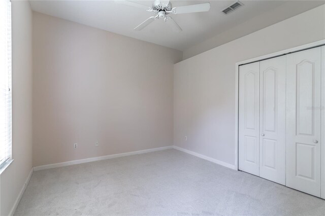 2340 Blackjack Oak St, Ocoee, FL 34761 - unfurnished bedroom with light carpet, a closet, and ceiling fan