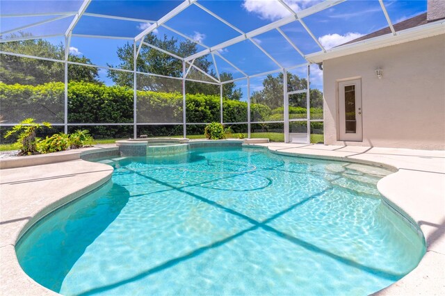 2340 Blackjack Oak St, Ocoee, FL 34761 - view of pool featuring a patio, a pool with connected hot tub, and glass enclosure