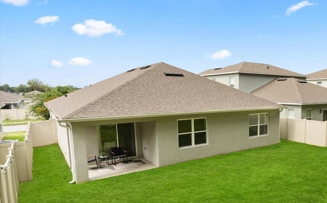 5684 Horseshoe Loop, Apopka, FL 32712 - back of property featuring roof with shingles, a fenced backyard, a patio area, and stucco siding
