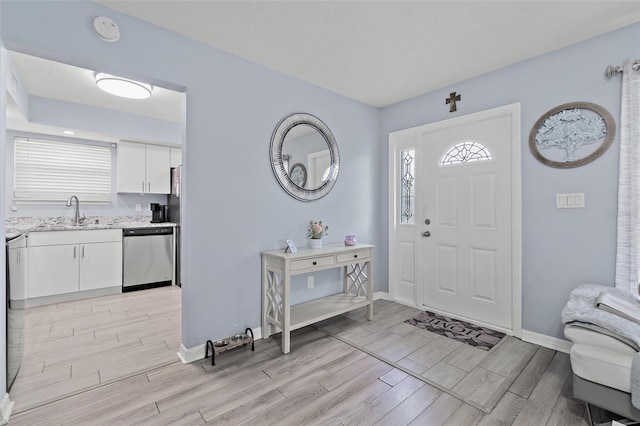entrance foyer featuring wood tiled floors and plenty of natural light