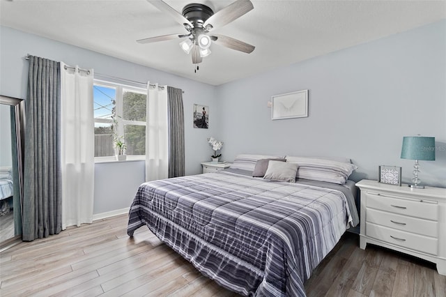 bedroom featuring wood finished floors and ceiling fan
