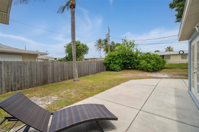 fenced backyard with a patio