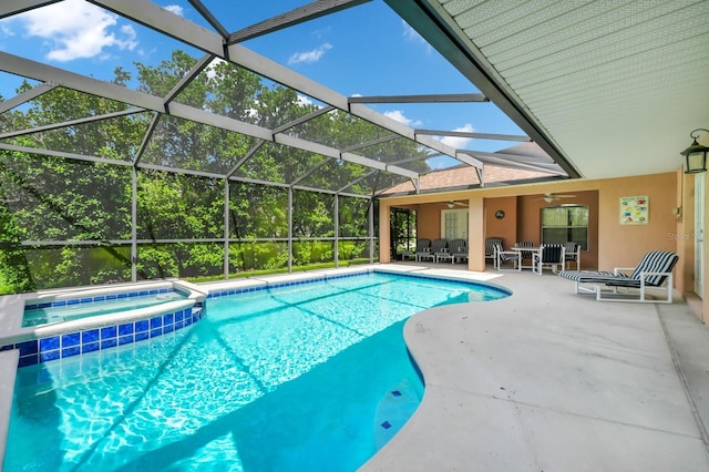 3422 Swallow Hill St, Clermont, FL 34714 - view of pool featuring ceiling fan, a patio area, a pool with connected hot tub, outdoor dining area, and a lanai
