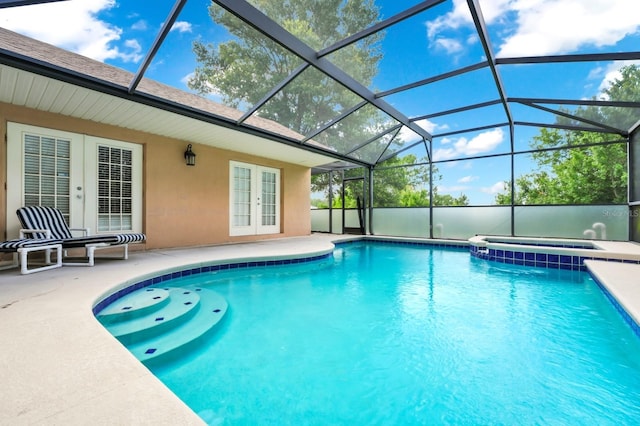3422 Swallow Hill St, Clermont, FL 34714 - view of pool featuring french doors, a patio area, a pool with connected hot tub, and a lanai