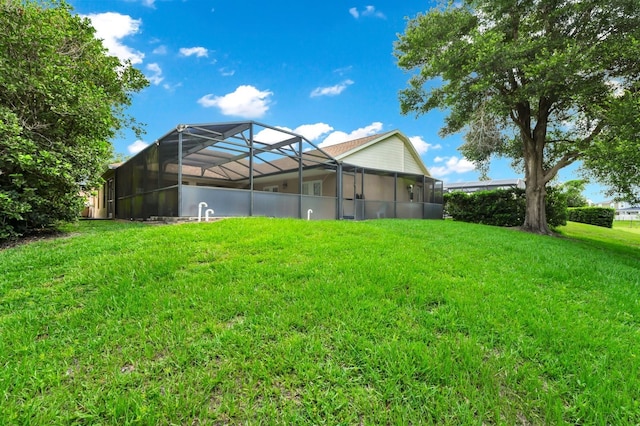 3422 Swallow Hill St, Clermont, FL 34714 - back of house with a lawn and glass enclosure