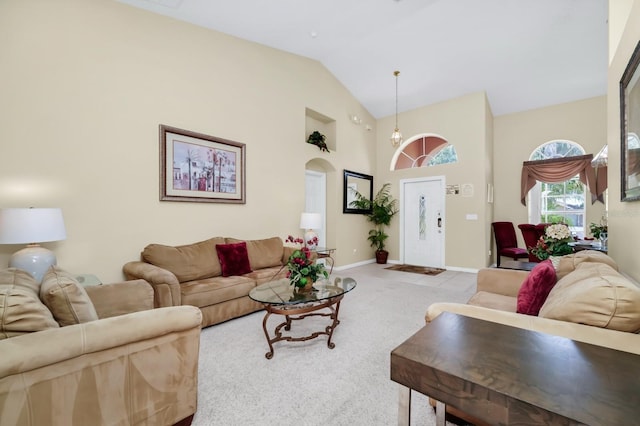 3422 Swallow Hill St, Clermont, FL 34714 - living room with high vaulted ceiling, carpet floors, and arched walkways