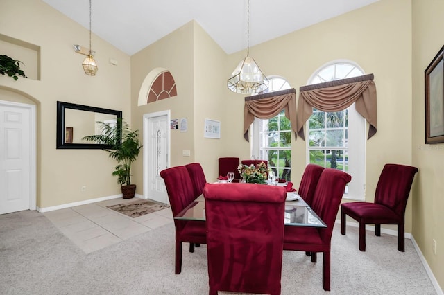 3422 Swallow Hill St, Clermont, FL 34714 - dining area featuring a high ceiling, carpet, and a chandelier