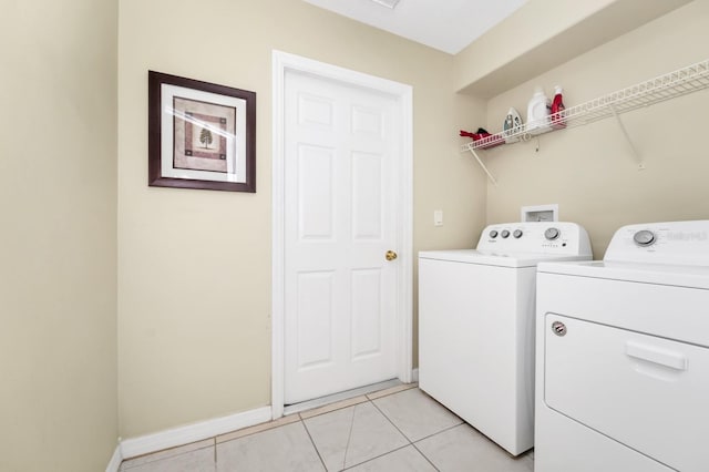 3422 Swallow Hill St, Clermont, FL 34714 - laundry room with washer and clothes dryer and light tile patterned floors