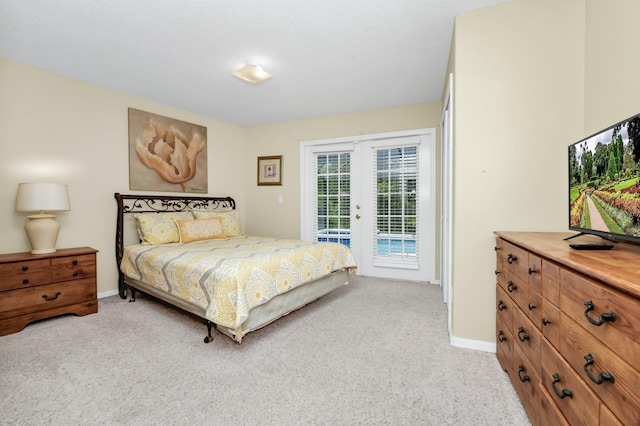 3422 Swallow Hill St, Clermont, FL 34714 - bedroom featuring access to exterior, french doors, and light colored carpet