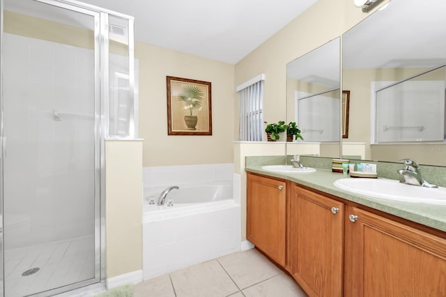 3422 Swallow Hill St, Clermont, FL 34714 - full bath featuring a shower stall, double vanity, a garden tub, and tile patterned floors