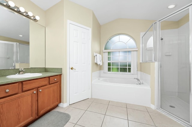 3422 Swallow Hill St, Clermont, FL 34714 - full bathroom featuring vanity, a bath, tile patterned flooring, a shower stall, and lofted ceiling