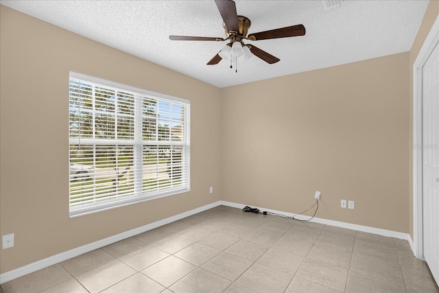 15175 Sugargrove Way, Orlando, FL 32828 - empty room with a textured ceiling, a ceiling fan, and light tile patterned flooring