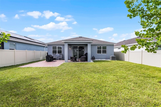 2936 Wild Mulberry Dr, Clermont, FL 34711 - back of house featuring stucco siding, a fenced backyard, a patio, a shingled roof, and an outdoor hangout area