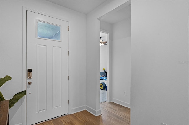 2936 Wild Mulberry Dr, Clermont, FL 34711 - foyer with light wood-type flooring and baseboards